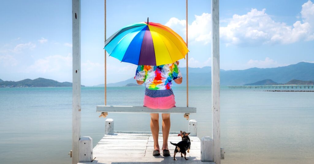 虹の橋をイメージした大型犬の旅立ち。空を見上げて微笑む飼い主と、穏やかに去っていく犬の後ろ姿。